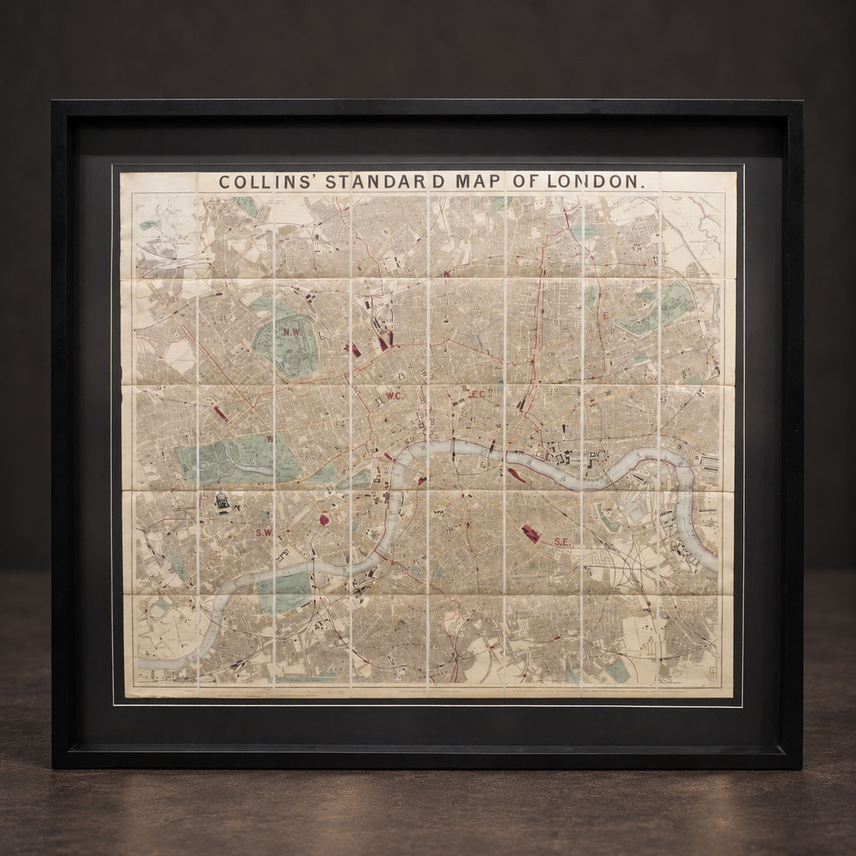 Map of London by Edward Stanford. Hand-colored lithograph. 1875. Recent frame.